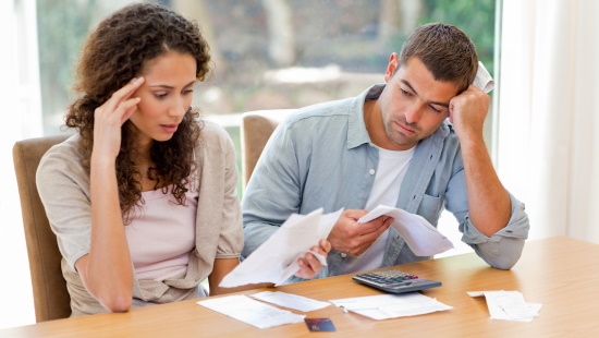 This image has an empty alt attribute; its file name is couple-and-money-stress.jpg